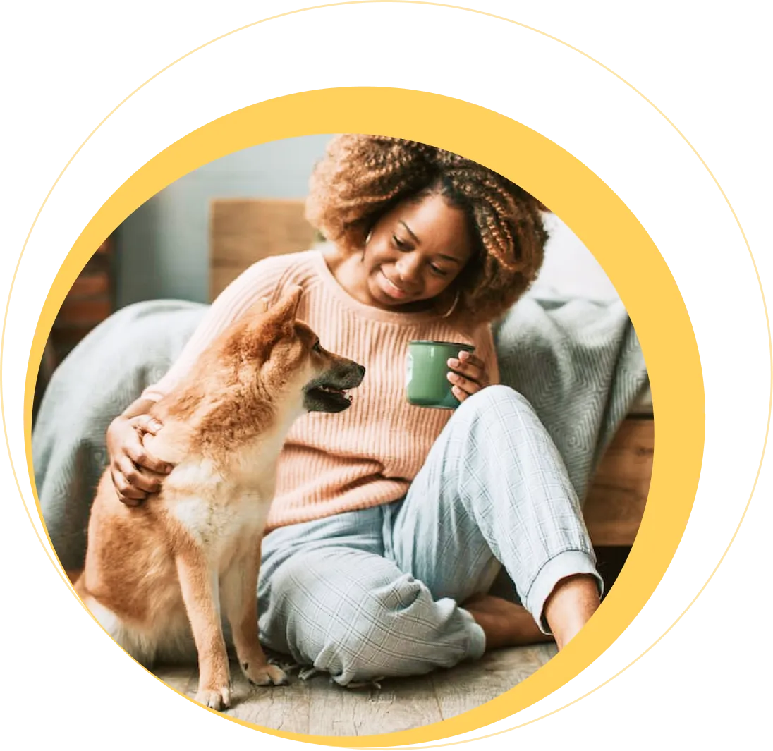A carer holding a small dog